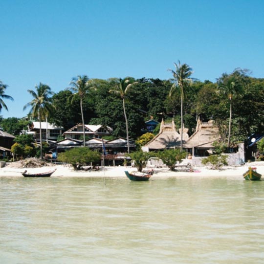 Boats moored at the jetty on the tropical island of Koh Phi Phi.