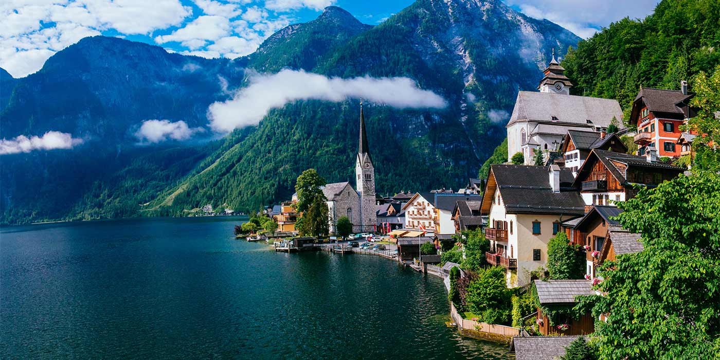 A beautiful waterfront village in Italy - one of the world's top holiday destinations - surrounded by mountains.