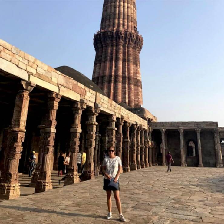 Visiting ancient buildings and temple in India on holiday.